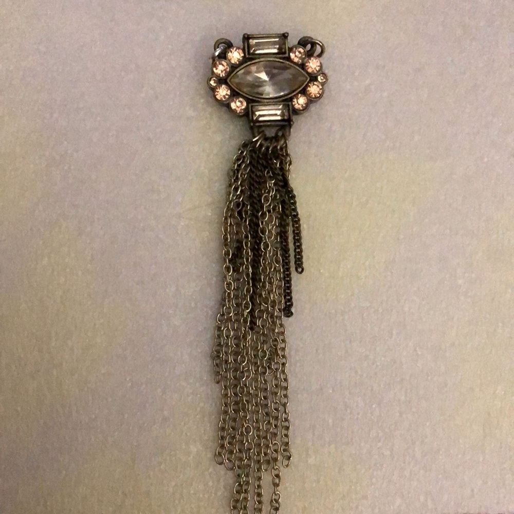 This is a pendant necklace thats gold and Silver tone.